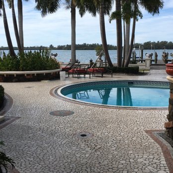 Master Marble Restoration - a pool surrounded by palm trees - Refinishing Services Near Me Master Marble Restoration - a pool surrounded by palm trees - Refinishing Services Near Me