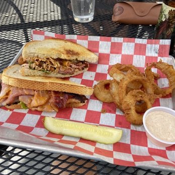 Scott Street Pub - Club Sandwich with a side of onion rings. - Pubs Near Me - Lafayette, Indiana Scott Street Pub - Club Sandwich with a side of onion rings. - Pubs Near Me - Lafayette, Indiana