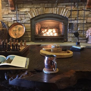 Occidental Guest House - View from the couch, looking at picturesque fireplace. - Guest Houses Near Me