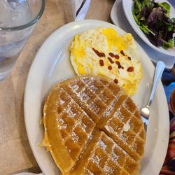 The Great Egg - Denton - 2 eggs over hard, a waffle, and dressed greens.