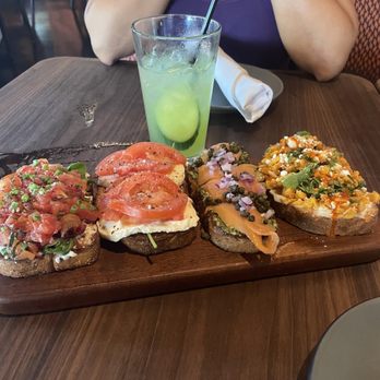 Postino Addison - Bruschetta Board with Mexican corn - smoked salmon- Mozzarella & Tomato - burrata bacon - Wine Bars Near Me - Dallas, Texas Postino Addison - Bruschetta Board with Mexican corn - smoked salmon- Mozzarella & Tomato - burrata bacon - Wine Bars Near Me - Dallas, Texas