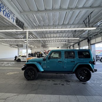 Enterprise Rent-A-Car - Here is my beautiful 2024 Sahara Jeep Hybrid in the shop today getting an oil change, tire rotation and check up.  I miss you!   Julie A - Car Rental Near Me - Reno, Nevada