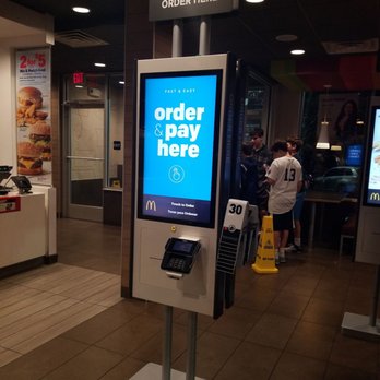 McDonald's - a pay here sign in a restaurant - Fast Food Near Me - Silver Spring, Maryland