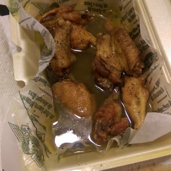 Wingstop - I asked for lemon pepper eings, wet. As you can see they are swimming in it! - Chicken Wings Near Me - Lansing, Illinois