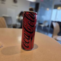 Escape Lounges - Slim can of coke zero