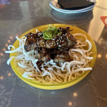 Flight Club Houston - Grilled beef on a stick with Crispy Rice noodles - Cocktail Bars Near Me - Houston, Texas