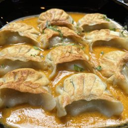 Chicken momo in sesame sauce