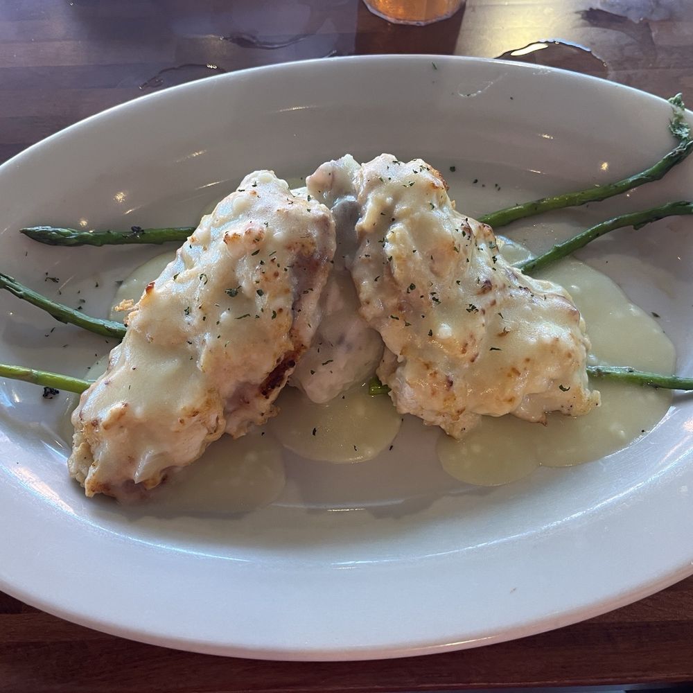 Oscar’s Alehouse - Chicken Chesapeake with 2 sautéed breasts, crab imperial and Chesapeake sauce. - Bars Near Me - Woodstock, Maryland Oscar’s Alehouse - Chicken Chesapeake with 2 sautéed breasts, crab imperial and Chesapeake sauce. - Bars Near Me - Woodstock, Maryland
