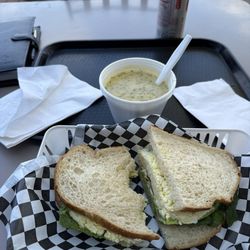 The Lunch Bag Sandwich Shop - Egg Salad Sandwich with a side of Broccoli Cheddar soup, chips and a Diet Coke.