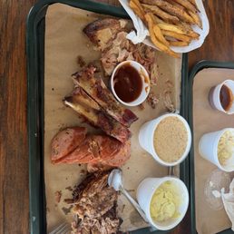 Pulled pork ribs, jalapeño sausage, and brisket french fries beans, coleslaw, bread, pudding, all absolutely perfect Pulled pork ribs, jalapeño sausage, and brisket french fries beans, coleslaw, bread, pudding, all absolutely perfect