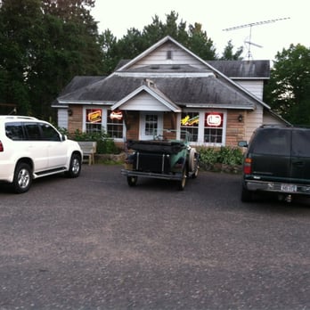 Wheel Inn - two vehicles parked in front of a building - American Near Me - Hayward, Wisconsin Wheel Inn - two vehicles parked in front of a building - American Near Me - Hayward, Wisconsin