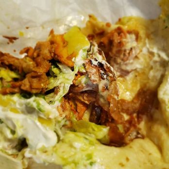 Taqueria El Paso - A look into the pork burrito it's not as filled like most trucks. - Mexican Near Me - West Bend, Wisconsin Taqueria El Paso - A look into the pork burrito it's not as filled like most trucks. - Mexican Near Me - West Bend, Wisconsin
