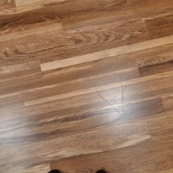 Scratched floor from Culligan technician.