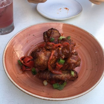 Babalu - The smoked wings covered in a spicy sauce and pickled hot peppers. Soooo good... - Tapas/Small Plates Near Me - Memphis, Tennessee Babalu - The smoked wings covered in a spicy sauce and pickled hot peppers. Soooo good... - Tapas/Small Plates Near Me - Memphis, Tennessee