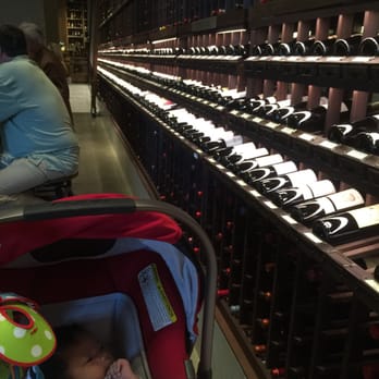 Wally's - Baby Hunter checking out the nice decor with racks of wine!! - New American Near Me - Beverly Hills, California