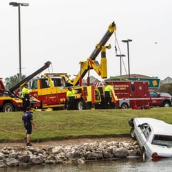New Braunfels Towing - New Braunfels Towing retrieves car from pond at Marketplace in New Braunfels.