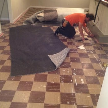 Carpet Star - a man laying on the floor - Carpet Cleaning Near Me - Buffalo, New York