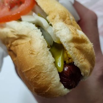Chicago Red Hots - a hand holding a hot dog - Hot Dogs Near Me - Milwaukee, Wisconsin