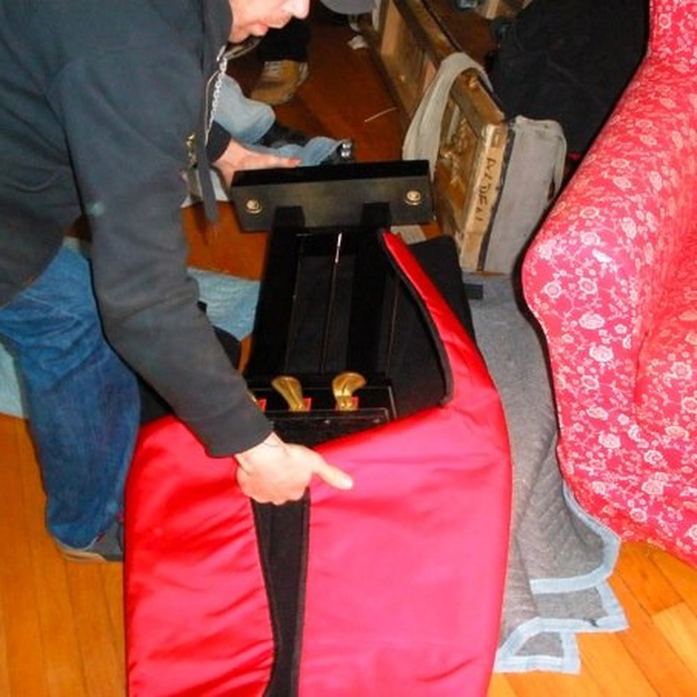 Alden's Piano - Putting the pedals into a special bag for transport. - Piano Services Near Me - Waukegan, Illinois Alden's Piano - Putting the pedals into a special bag for transport. - Piano Services Near Me - Waukegan, Illinois