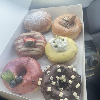 Jayden's Donuts - (left to right, top to bottom) strawberry cream, cookie butter, strawberry lemon, passionfruit?, blueberry, chocolate - Donuts Near Me - Fountain Valley, California Jayden's Donuts - (left to right, top to bottom) strawberry cream, cookie butter, strawberry lemon, passionfruit?, blueberry, chocolate - Donuts Near Me - Fountain Valley, California