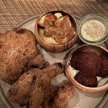 Husk - Fried chicken and gravy with rutabaga and hush puppies. - Southern Near Me - Nashville, Tennessee Husk - Fried chicken and gravy with rutabaga and hush puppies. - Southern Near Me - Nashville, Tennessee