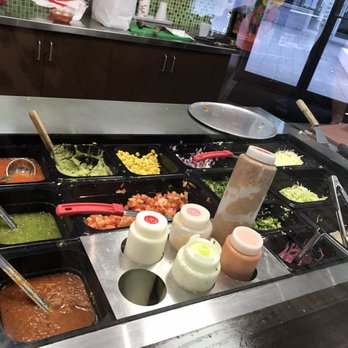 Quesada Burritos & Tacos - a variety of condiments - Mexican Near Me - Brampton, Ontario Quesada Burritos & Tacos - a variety of condiments - Mexican Near Me - Brampton, Ontario