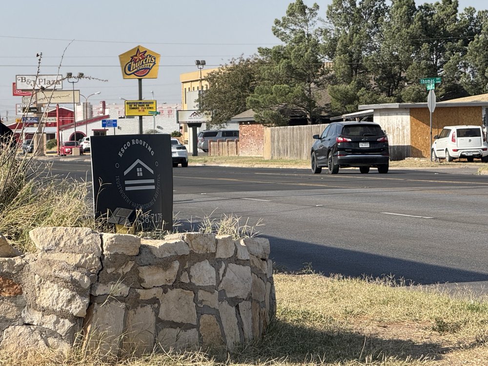 Slide of Esco Roofing