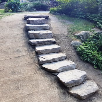 Joe Gauci Landscaping - a stone path in a park - Landscaping Near Me - Bedford, New Hampshire Joe Gauci Landscaping - a stone path in a park - Landscaping Near Me - Bedford, New Hampshire