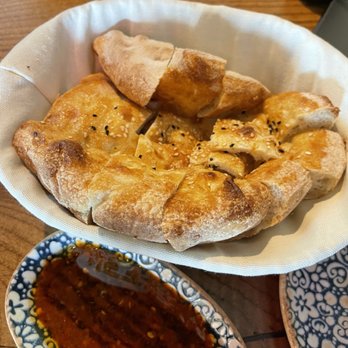Chef’s Table - Bread and spicy dipping sauce at Chef's Table Mediterranean Grill - Mediterranean Near Me - San Antonio, Texas Chef’s Table - Bread and spicy dipping sauce at Chef's Table Mediterranean Grill - Mediterranean Near Me - San Antonio, Texas