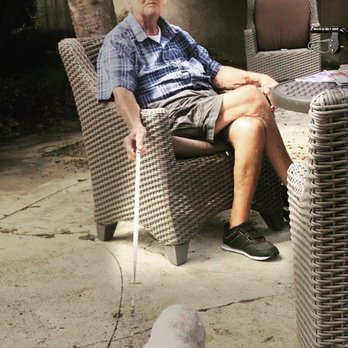 Wyndham Lakes - Residents sit in sun just outside main building - Assisted Living Facilities Near Me - Jacksonville, Florida Wyndham Lakes - Residents sit in sun just outside main building - Assisted Living Facilities Near Me - Jacksonville, Florida
