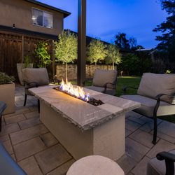 Little Pink Door Gardens - Custom-built fire pit with garden lighting