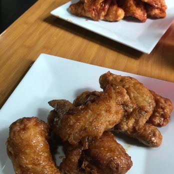 Bonchon Chapel Hill - Lunch portion of wings - soy garlic, combo meat (and spicy strips in the background) - Korean Near Me - Chapel Hill, North Carolina Bonchon Chapel Hill - Lunch portion of wings - soy garlic, combo meat (and spicy strips in the background) - Korean Near Me - Chapel Hill, North Carolina