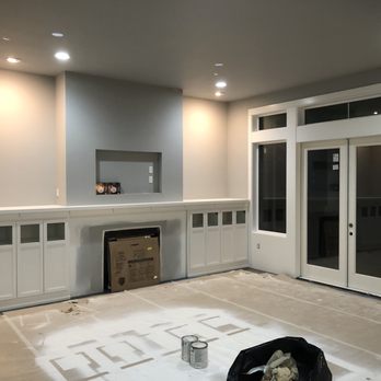 MR Coatings - Custom built in cabinets with mantle shelf after painting - Painters Near Me
