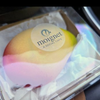 Moignet A Social Cafe - Mango mousse with white chocolate shell - Bakeries Near Me - Las Vegas, Nevada Moignet A Social Cafe - Mango mousse with white chocolate shell - Bakeries Near Me - Las Vegas, Nevada