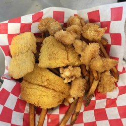 Pop's Fish and Shrimp - Pop's Deluxe Platter! Comes with your choice of homemade tarter or cocktail sauce.