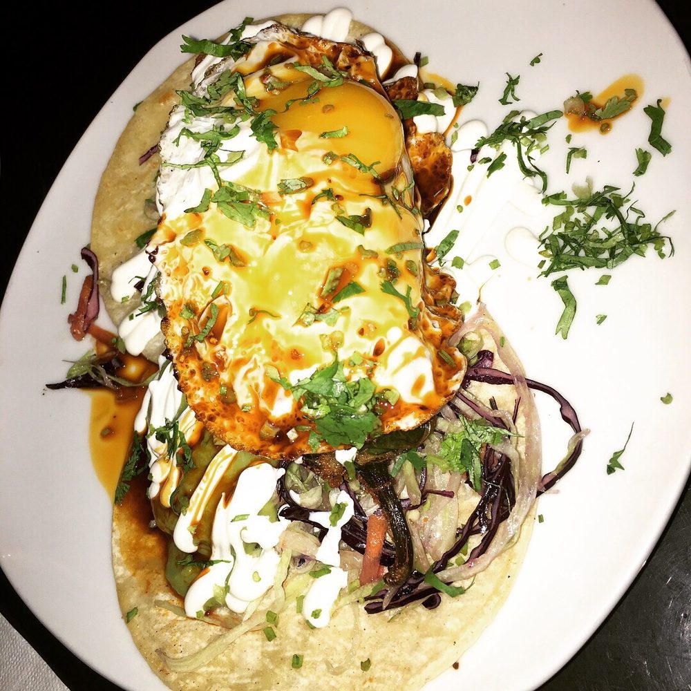 Caifan Tacos Bar - Chorizo Stuffed Jalapeños Rellenos Wrapped in Bacon in a Taco topped with shredded cabbage, cheese, crema and guacamole and egg. - Mexican Near Me - Montreal, Quebec Caifan Tacos Bar - Chorizo Stuffed Jalapeños Rellenos Wrapped in Bacon in a Taco topped with shredded cabbage, cheese, crema and guacamole and egg. - Mexican Near Me - Montreal, Quebec