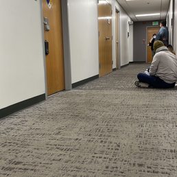 Rest of hallway full of people behind locked office door. Rest of hallway full of people behind locked office door.