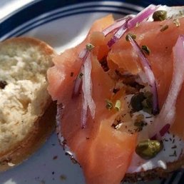 Toasted with our own lox and cream cheese, capers and onion. Toasted with our own lox and cream cheese, capers and onion.