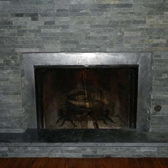 Ledge Stone Tile Installation Around Fireplace With Soapstone