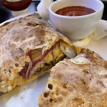 Tailgaters - Calzone, sausage, mushrooms, onions and Canadian bacon - Pizza Near Me - Surprise, Arizona Tailgaters - Calzone, sausage, mushrooms, onions and Canadian bacon - Pizza Near Me - Surprise, Arizona