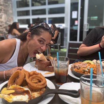 Hash Kitchen - Sister enjoying the Banana Split Brioche French Toast - Breakfast & Brunch Near Me - Peoria, Arizona