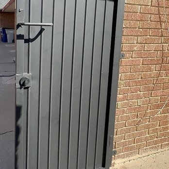 Copperhead Welding - AFTER: the gate is fastened securely into the brick wall, new handle, and new lock box. It's also freshly painted. - Fences & Gates Near Me