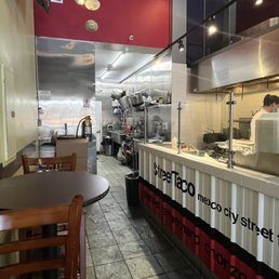 a man preparing food in a restaurant kitchen a man preparing food in a restaurant kitchen