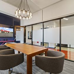 The Rec Room - Quiet, private conference room with premium video conferencing equipment.