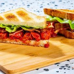 Cafe on Main - Our BLT is very tasty! We top your sandwich with a special mayo, loads of bacon, ripe fresh tomato, and crisp leaf lettuce.