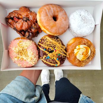 Doughnut Party - a person holding a box of doughnuts - Donuts Near Me - Edmonton, Alberta Doughnut Party - a person holding a box of doughnuts - Donuts Near Me - Edmonton, Alberta