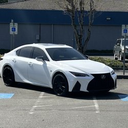 Les Schwab Tire Center - This car is parked in two disabled persons parking spots. This car carries no placard for this parking spot.