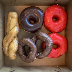 The Donut Stop - A pig out session for two- Cinnamon Twist, Chocolate Raised, Blueberry and the Cherry Raised.
