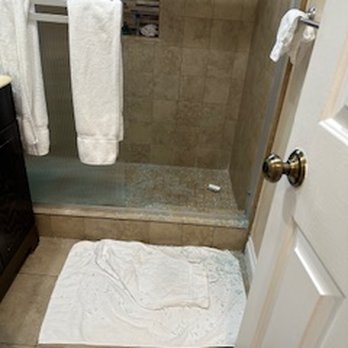 Nite Inn at Universal City - photo of glass all over the bathroom floor. i had to throw a towel on the floor to get out of the shower without causing further injury - Hotels Near Me - Studio City, California Nite Inn at Universal City - photo of glass all over the bathroom floor. i had to throw a towel on the floor to get out of the shower without causing further injury - Hotels Near Me - Studio City, California
