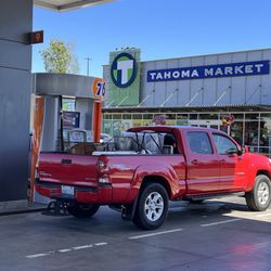 Tahoma Market - noticed a guy puts his dog in a small cage in the back of his truck in hot weather. Looks like animal cruelty
